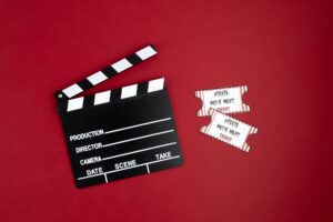 Movie clapperboard and halloween decoration. Horror movie night