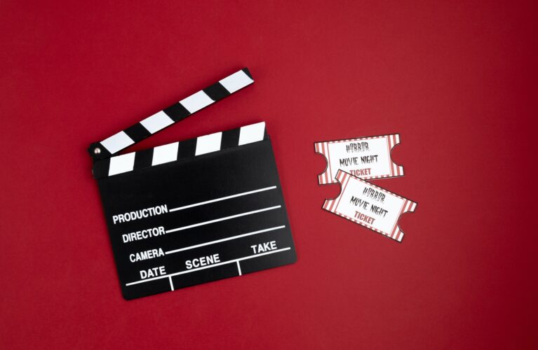 Movie clapperboard and halloween decoration. Horror movie night